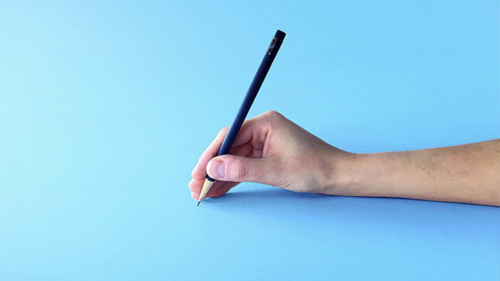 a hand holding a pencil to write with it